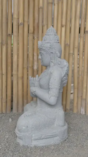 Product image 6 of the product “Seated Dewi Sri, position chakra turning the wheel, 79 cm high riverstone grey, modell with sativa ”